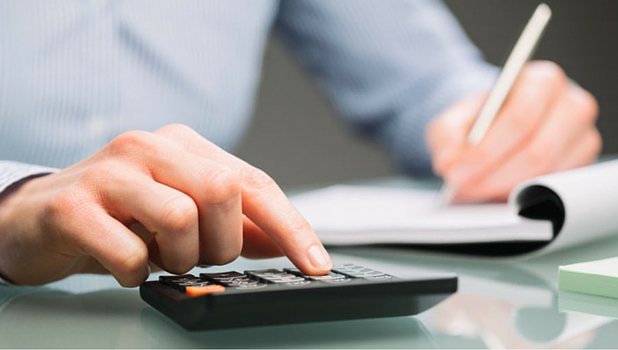 Male using a calculator