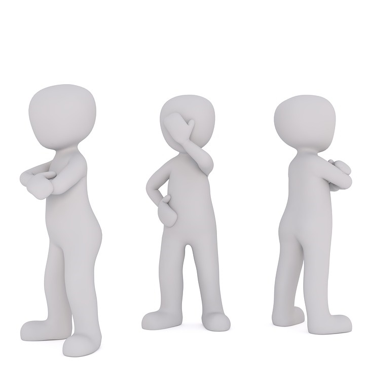 3 white model figures