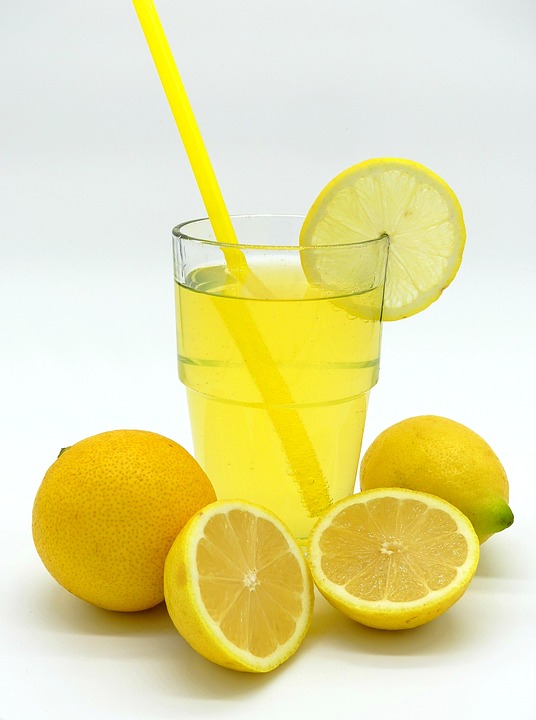lemonade with glass and lemons