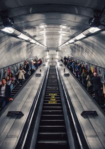 People on escalators going up and down